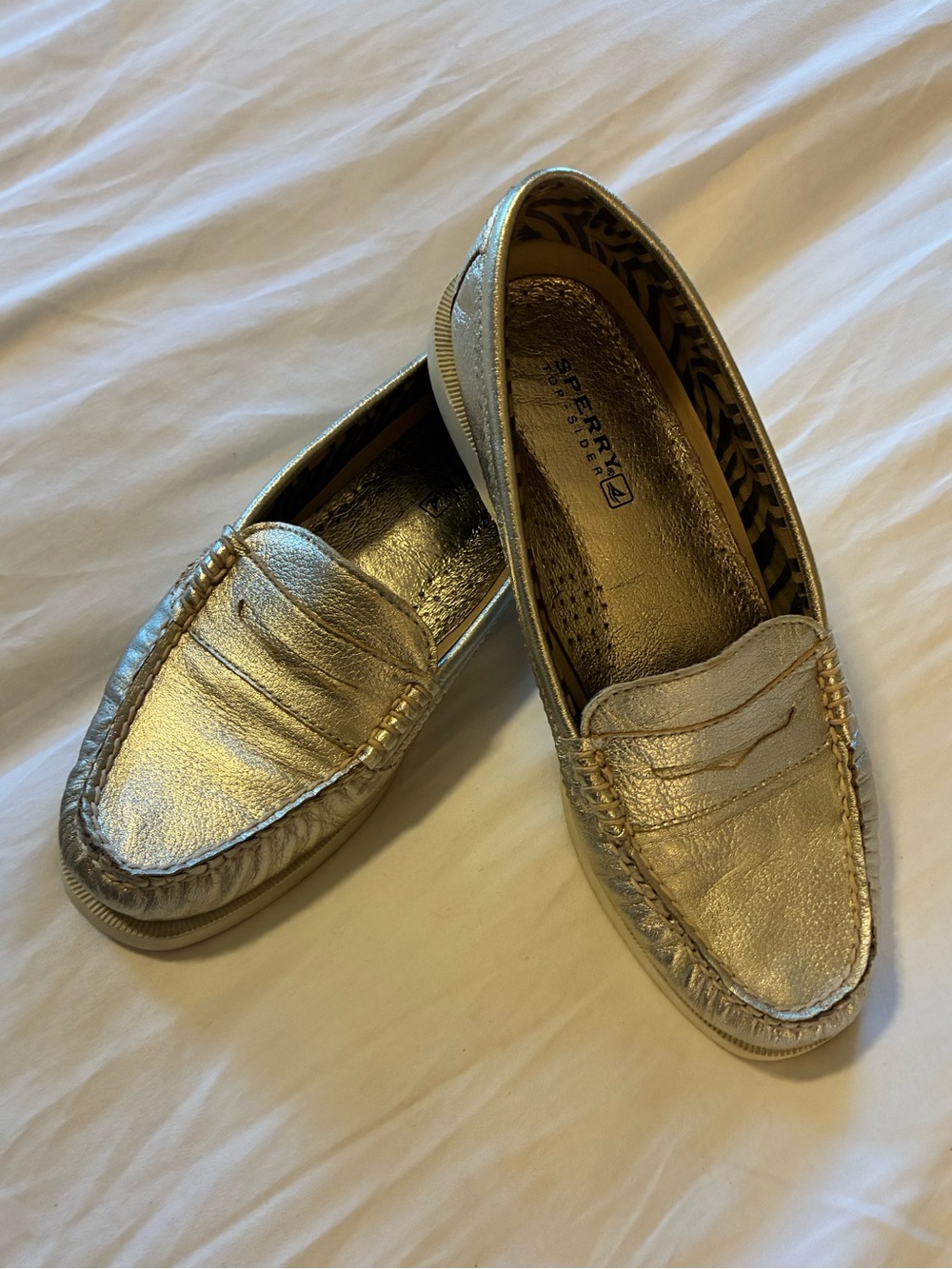 Sperry Women's Metallic Gold Slip-On loafer.